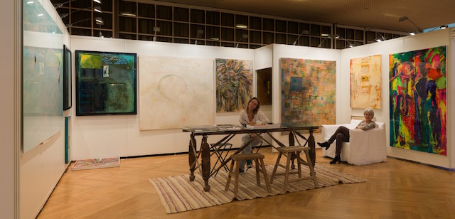 Exhibition booth at Art Zurich with paintings on display